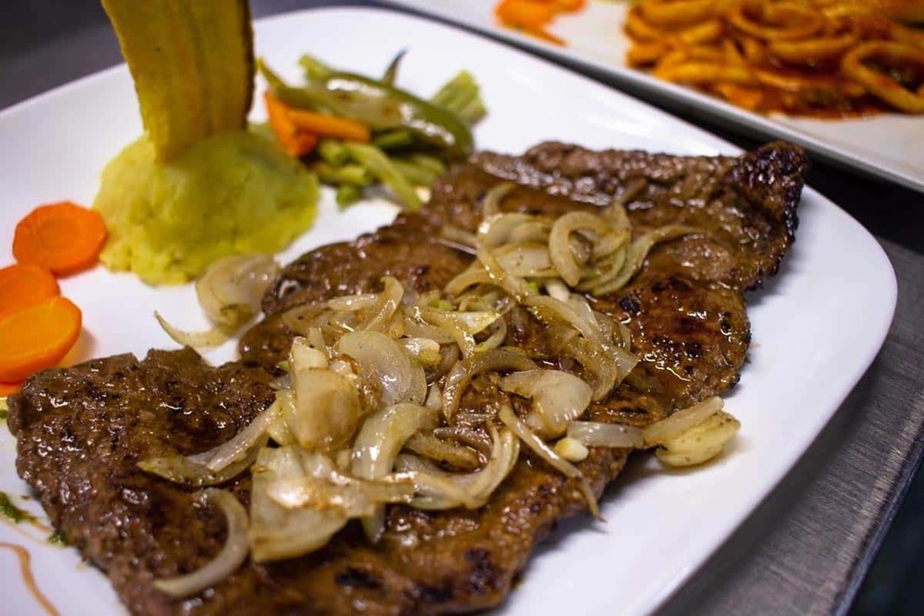 Bistec de cerdo a la plancha